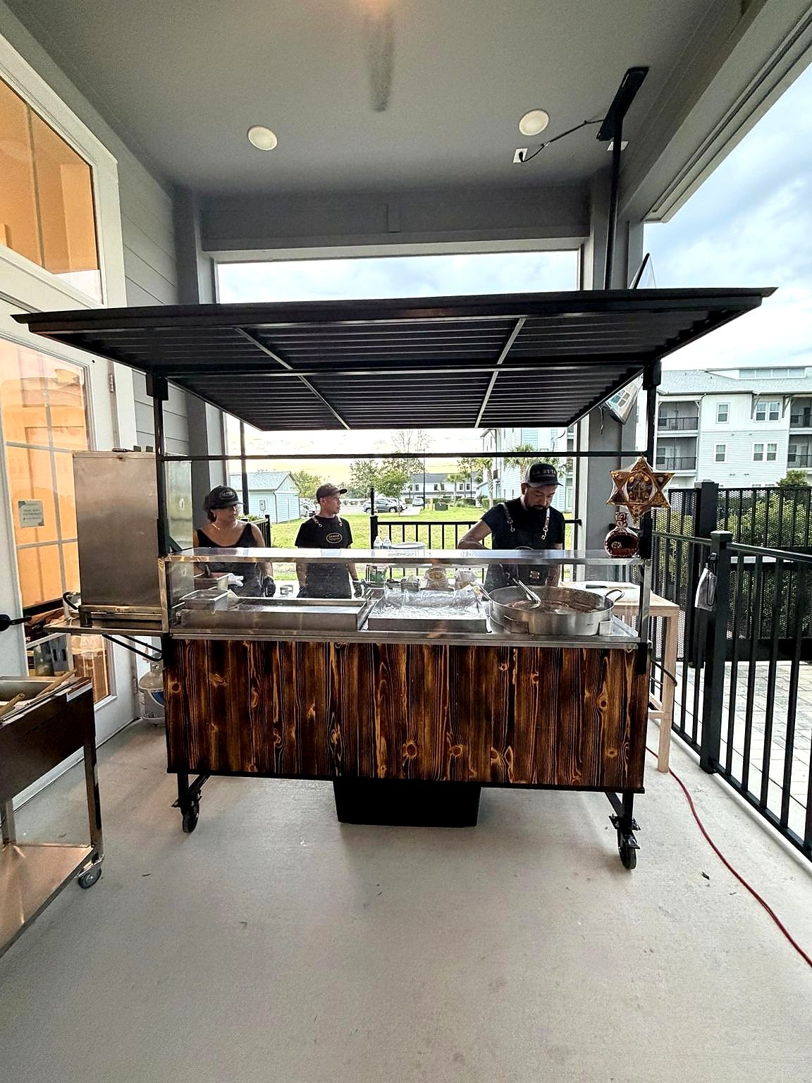 La Ruta taco cart set up under cover