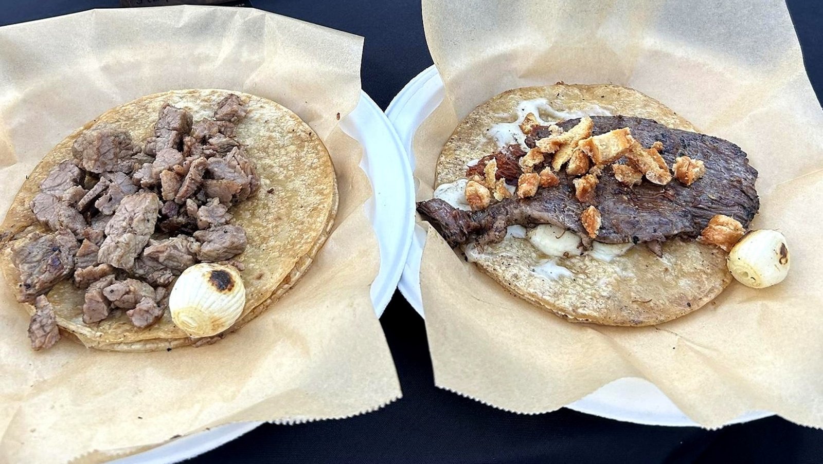 Close-up of La Ruta street tacos with fresh toppings